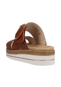 Braune Leder-Sandale mit runder Schnalle, gepolstertem Fußbett, dicker geflochtener Mittelsohle und strukturiertem weißen Außensohle.