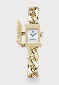 Orologio bracciale in oro con cassa quadrata e texture, quadrante bianco e dettagli blu. Presenta un design a cerniera per un facile accesso.