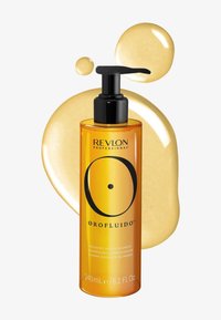 Flacon de shampooing Revlon Orofluido Radiance Argan 240 ml avec pompe noire et gouttelettes de liquide doré en arrière-plan.
