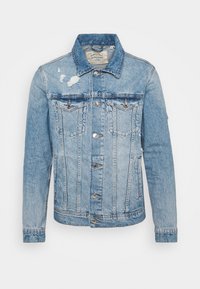 Světle modrá džínová bunda s klasickým límcem, zapínáním na knoflíky a dvěma náprsními kapsami. Obsahuje znaky opotřebení a viditelné detaily švů.