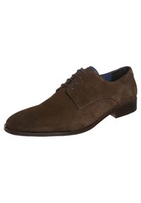 Chaussure montante en daim marron avec un bout pointu, une surface lisse et une doublure en cuir ton sur ton. Présente des coutures discrètes et un talon bas.