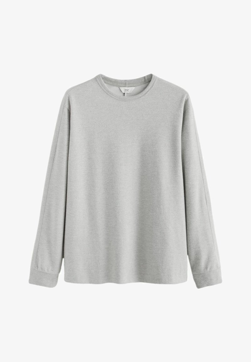 Camiseta térmica de manga larga en gris claro con cuello redondo, textura acanalada y puños, mostrada sobre un fondo blanco.