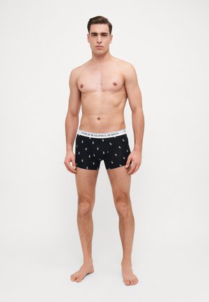 Boxers noirs avec une ceinture logo blanche de Polo Ralph Lauren ; décorés de petites impressions de joueur de polo blanc partout. Matière douce et extensible.