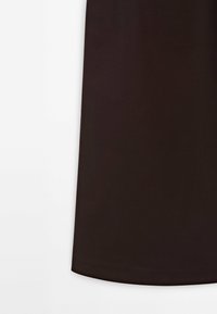 Black fabric skirt with a smooth texture and an A-line silhouette, featuring a simple, clean hem without additional embellishments.