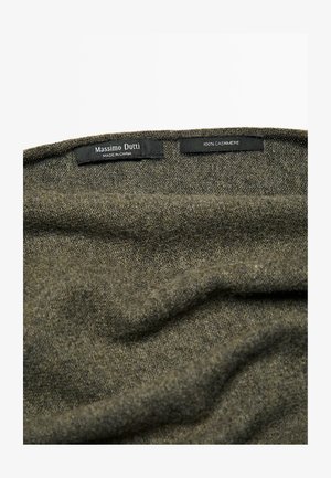 Dark olive green cashmere fabric, soft texture, labels reading "Massimo Dutti" and "100% CASHMERE" visible along the edge.