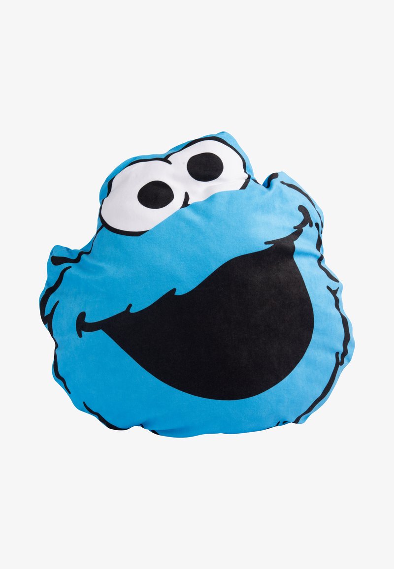 Cuscino blu con il volto di un personaggio dei cartoni animati, caratterizzato da grandi occhi neri e un ampio sorriso nero. Tessuto morbido con una forma arrotondata.