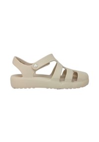 Beige plastic sandals with a closed toe and three wide straps. There is a circular logo on the side and a textured footbed.