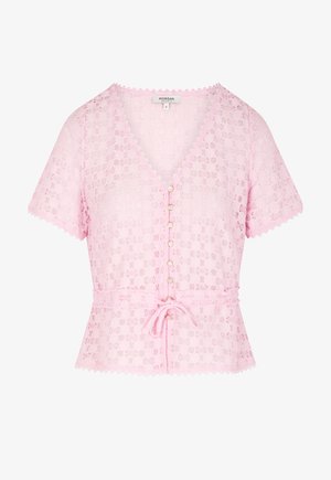 Light pink short-sleeve lace cardigan with scalloped edges, pearl buttons down front, and a tied waist belt.