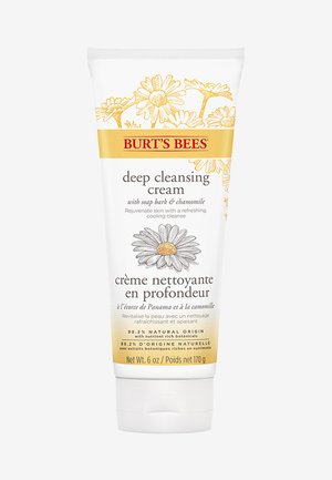 Crema detergente profonda Burt's Bees in un tubo da 170 g, bianco con accenti gialli, con illustrazioni botaniche e testo bilingue.