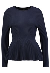 Laivastonsininen ribbineulottu pitkähiha-paita, jossa on istuva yläosa ja levenevä helma. Siinä on kohokuvioitu kuviointi ja pyöreä pääntie.