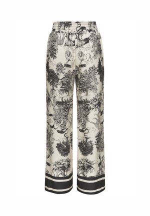 Wide-leg cream pants with black detailed wildlife and tree print, elastic waistband, and black double-stripe trim at hems.