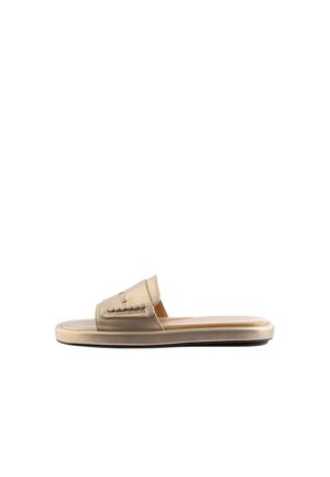 Beige slip-on sandal with padded strap featuring stitched decorative details and flat sole on white background.
