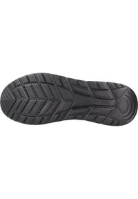 Suola di scarpa in gomma nera con motivi testurizzati, tra cui zigzag e impugnature circolari, con fori di ventilazione per una maggiore trazione.