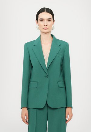 Green tailored blazer with a notched lapel, single button closure, and front pockets. Smooth fabric with a structured fit.