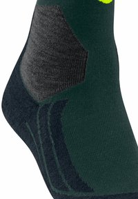 Dunkelgrüne Socke mit grauen Akzenten, ausgestattet mit einem strukturierten Patch und einem gerippten Design. Enthält dezente Streifen an der Knöchelpartie.