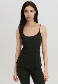 Black tank top with thin straps, soft fabric, relaxed fit, and scalloped hemline. Paired with matching bottoms for a cohesive look.