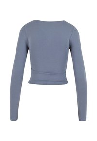 Långärmad kort topp i mjukt, stretchy grått tyg. Har en rund halsringning och sömlös design för en jämn passform.