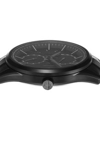 Orologio analogico nero con finitura lucida, cassa rotonda e quadrante testurizzato con indicatori e sub-quadranti d'argento. Accenti argentati dei pulsanti.