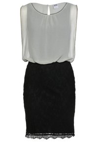 Robe sans manches avec un haut en chiffon blanc et une jupe en dentelle noire ajustée, présentant un décolleté en forme de trou de serrure et un ourlet festonné.