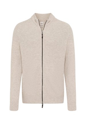 Beige gestrickte Zip-Cardigan mit Stehkragen, gerippter Textur, langen Ärmeln und einem dunklen Reißverschluss.