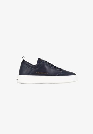 Navy leather sneakers with gold logo detail, white rubber sole, round toe, and lace-up design. Features a tab at the heel for easy wear.