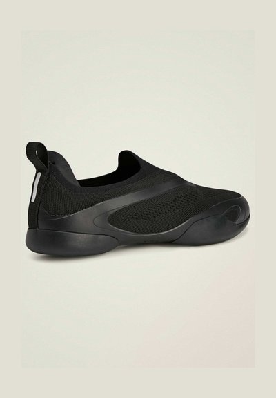 Black knit slip-on shoe with a sleek design. Features a smooth rubber sole and textured fabric sections for breathability. No visible fasteners.
