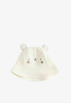 Pălărie bucket din bumbac alb, cu design brodat cu fața unui urs, accente roz pal și detalii texturate la urechi, având o borură largă.