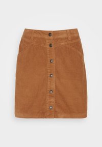 Gonna di velluto a coste in marrone caldo, con chiusura a bottoni frontale, tasche laterali e design aderente. Superficie testurizzata con strisce verticali.