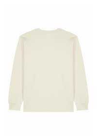 T-shirt à manches longues de couleur crème, en tissu doux. Il présente un col rond et des poignets ajustés avec une texture lisse et homogène.