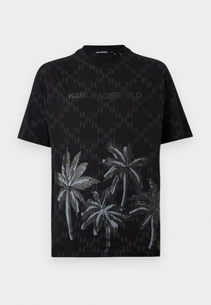 T-shirt noir à manches courtes avec motif discret de logos sur l'ensemble, graphique de palmier en bas et texte "KARL LAGERFELD" sur la poitrine.