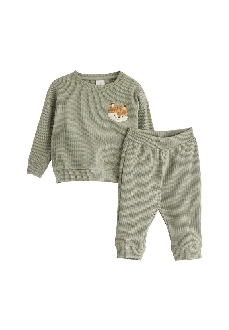 Grünes geripptes Zweiteiler-Outfit mit einem Langarmoberteil mit einer Fuchs-Gesicht-Applikation und elastischen Hosen mit gerippten Bündchen.