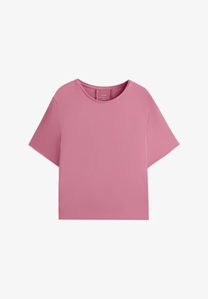 T-shirt cropped rosa con maniche corte, scollatura rotonda e texture liscia. Presenta un design semplice e minimalista senza motivi o decorazioni.