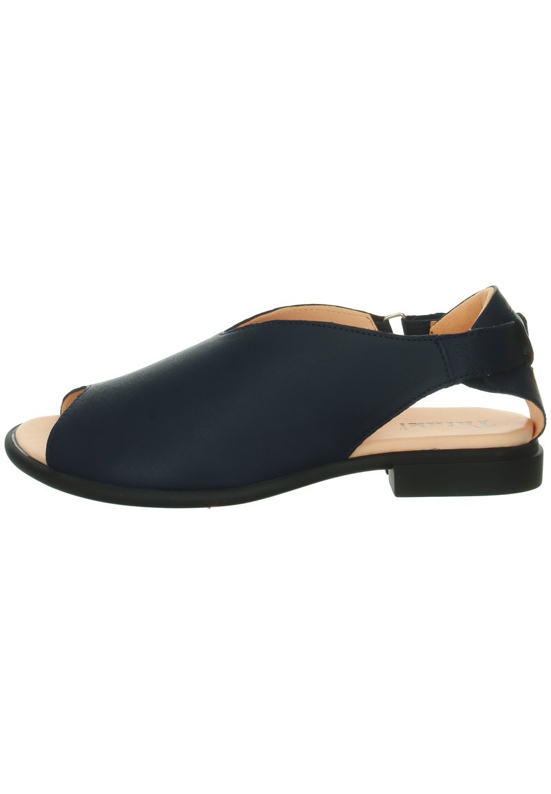 Navy blue open-toe sandal with soft leather upper, low black sole, and cutout side design. Minimalist style with a smooth texture.