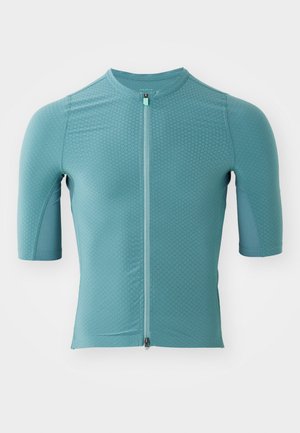 Maillot de cyclisme à manches courtes en tissu bleu clair texturé avec une fermeture éclair à l'avant, doté d'un col rond et d'un design ajusté.