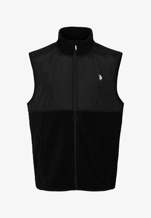 Černá vesta s vysokým límcem, vybavená zipem po celé délce, předními kapsami a měkkou fleecovou dolní částí. Horní část je hladká a elegantní.