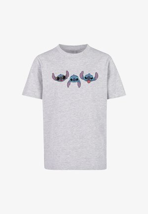 Šedé bavlněné tričko s třemi potištěnými kreslenými postavami s modrou pletí a velkými ušima, které vykazují různé výrazy na hrudi.