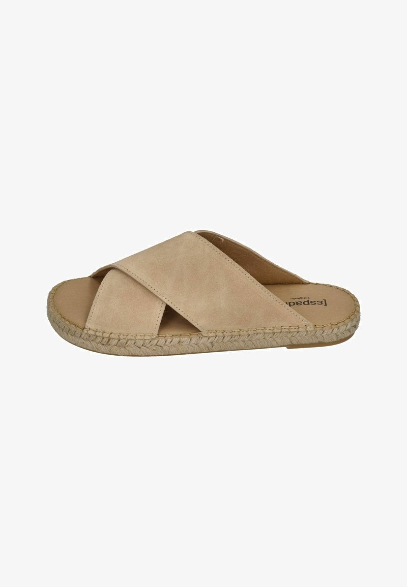 Suede slide sandal in beige with crisscross straps and an espadrille jute sole. Features a flat design and rounded toe.