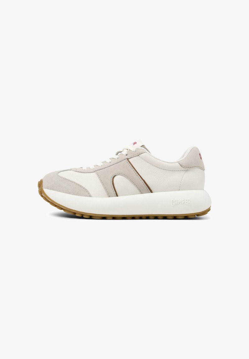 Sneakers featuring a combination of white leather and light grey suede, rounded silhouette, lace-up design, and textured beige rubber sole.