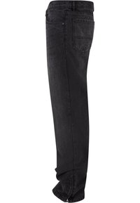 Black denim jeans with a straight leg design, featuring five pockets, subtle stitching, and a zipper at the hem. Clean finish.