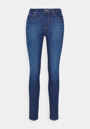Stramme jeans i mørkeblå denim, der har fem lommer, guldtråd og lynlås. Glat tekstur med en let falmet finish.