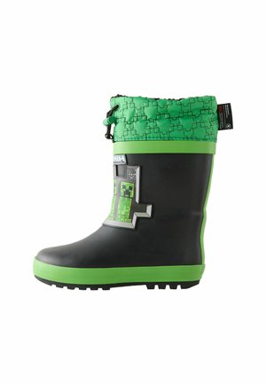 Zwarte rubberen regenlaars met een groen en grijs patroon aan de bovenkant, voorzien van een groene zool en een pixels ontwerp van een figuur aan de zijkant.