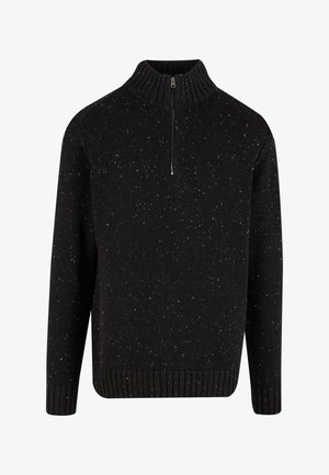 Melnā adītā džemperis ar ar rāvējslēdzēju augstu apkakli, ar punktveida tekstūru. Ribota apmale un piedurknes, nodrošinot pieguļošu siluetu.