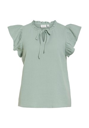 Light green short-sleeve blouse with ruffled sleeves, a round ruffled neckline, and a front tie detail.