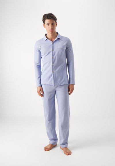 Light blue pajama set made of soft fabric. Long-sleeved button-up shirt with a pocket, paired with matching pants, both featuring a smooth texture.