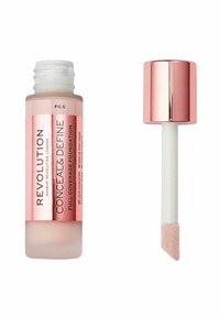 Flytande foundation i en klar flaska med en vit applikatorstav. Korken är i metalliskt roséguld. Etiketten säger "Dölj & Definiera".