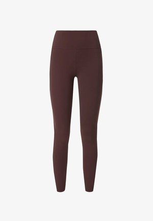 Bruine, hoge taille leggings gemaakt van rekbare stof. Gladde textuur, nauwsluitend ontwerp, zonder zichtbare naden of versieringen.