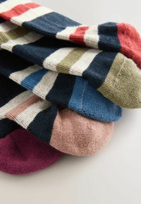Striped socks in various colors: navy, red, green, blue, pink, and burgundy. Soft knit texture with contrasting colors and patterns.