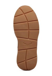Rubber outsole with a textured grip pattern, featuring deep grooves and a light brown color, branded with "Voile Blanche" near the heel.