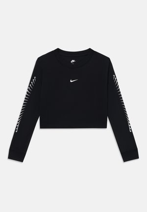 Chemise noire à manches longues, raccourcie, fabriquée en coton. Présente un petit logo Nike blanc sur la poitrine et un design blanc unique le long des manches.