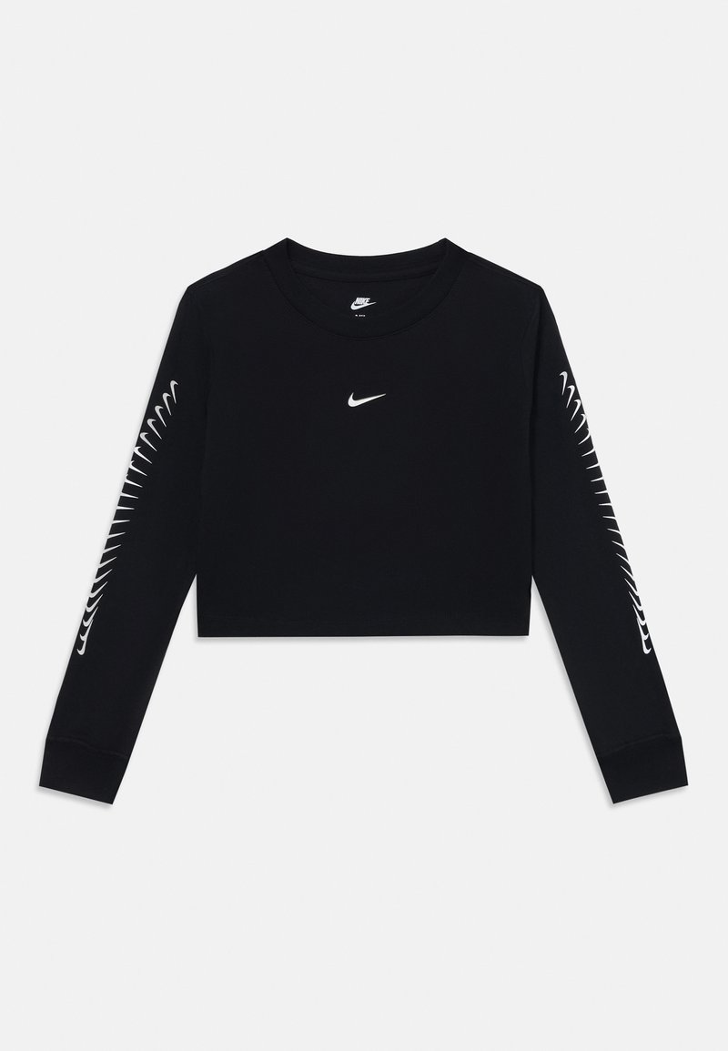 Black cropped long-sleeve shirt made of cotton. Features a small white Nike logo on the chest and a unique white design along the sleeves.